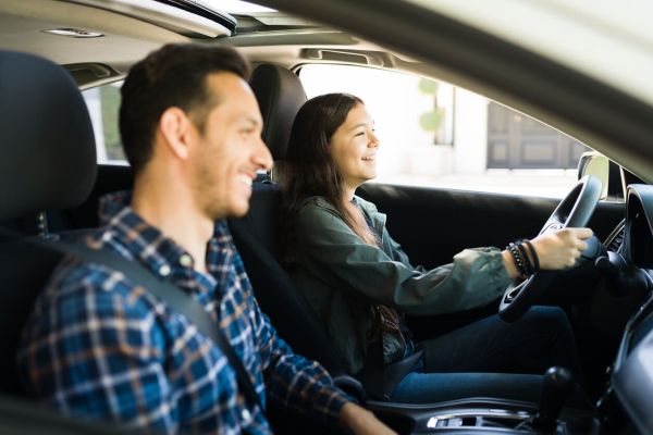 A Girl Behind the wheel with the instructor